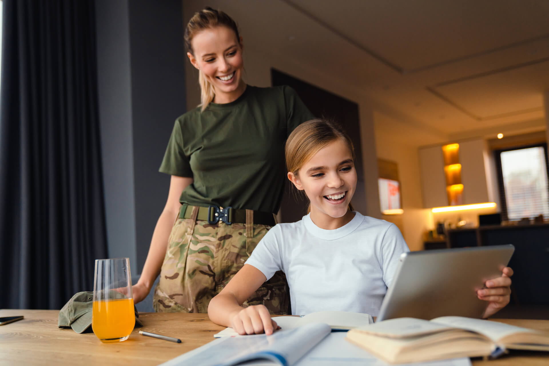 beautiful-happy-military-woman-doing-homework-with-2022-02-14-14-52-24-utc